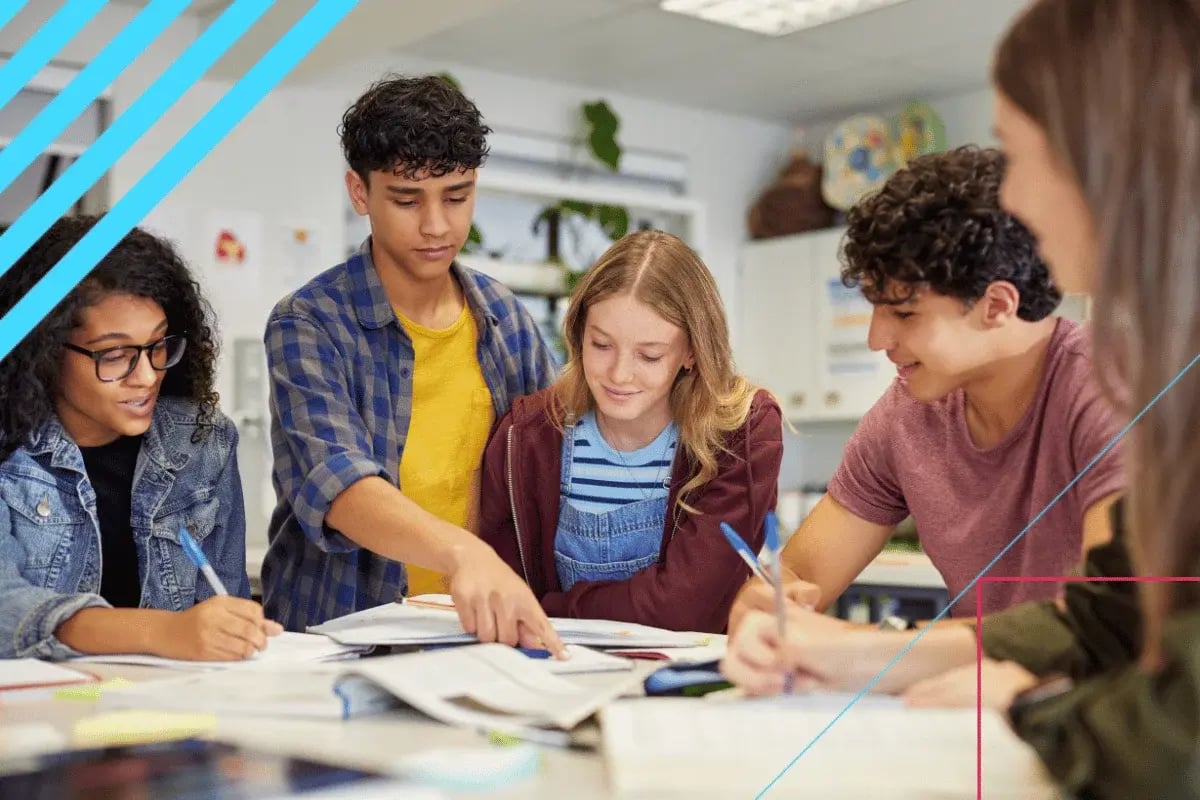 Five diverse individuals collaborate at a table with books and notes, showcasing teamwork, active learning, and group discussion.